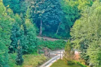 Gated driveway, the slight fork showing a second gate and driveway is on the property but rarely used.