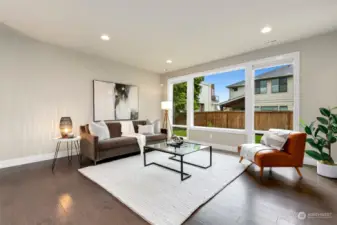 Large windows overlook spacious back yard.