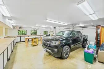 Detached 3 car garage with heated shop below the game room. Look at all the cabinet and counter space!