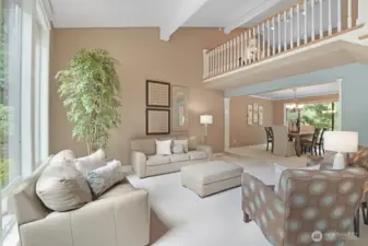 Formal living room with vaulted ceiling as well as floor to ceiling windows