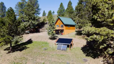 Tranquil off-grid retreat offers secluded serenity and stunning views.