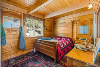 Main bedroom, creates a warm inviting and rustic feel.