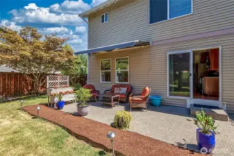Expanded patio with ample room for seating and barbeque area. Kitchen access perfect for entertaining.