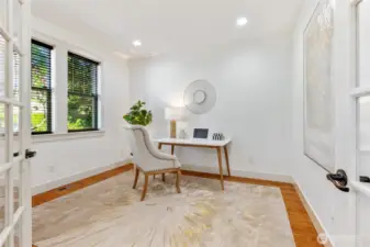 Home office or 5th bedroom on main. There's also a 3/4 bathroom with shower on main as well.
