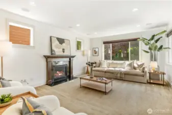 Family room with cozy gas fireplace, and built in speakers