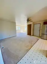 This picture shows the open concept flow design from the kitchen to the living room.