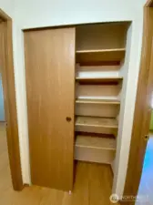 Lots of storage in hallway linen closet.