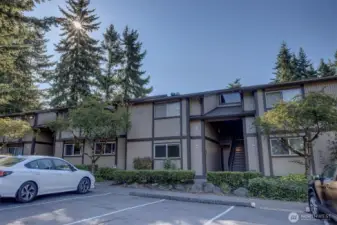 Designated parking space is in front of unit.  Plenty of guest parking nearby.
