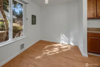 Designated dining room or great space for home office.  Window looks onto open green space common area.