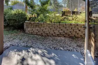 Unique feature of this unit is the raised garden area where a peach tree and blueberry bushes have been planted.  Water source is steps away.  Unit storage closet is on the left.