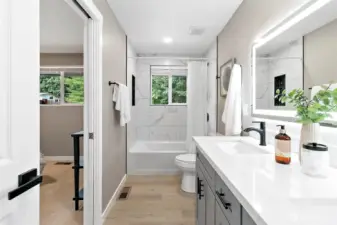 Main bath with separate entrance to primary bedroom