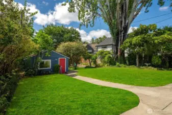 Large backyard view of the detached garage.