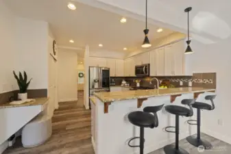Another view of the kitchen highlighting the breakfast bar