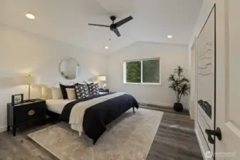 The very spacious Primary suite has vaulted ceilings and a modern & efficient ceiling fan.