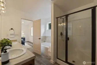 Primary en-suite has two sinks, tub & shower, and a spacious walk-in closet
