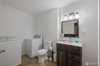 This level also includes a full bathroom with a washer and dryer, adding everyday convenience and independence. Whether you use the space as a guest suite or a secondary living area, it’s designed to stand on its own.