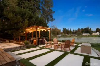 Cozy firepit lounge with water views — the perfect spot for s’mores nights, wine with friends, or quiet evenings by the lake.