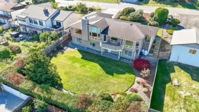 View of the landscaped back yard. Entry on either side from front.