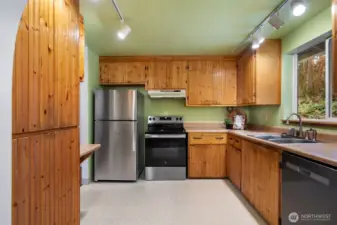 Cute kitchen. All cabinets were made by the owner