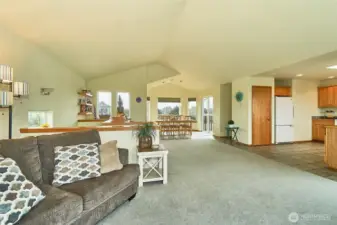 View of open concept, dining kitchen and living room, with 1/2 bath. (top floor with views)