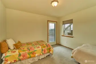 3rd bedroom fits 2 twin beds and has own door to deck. Middle level