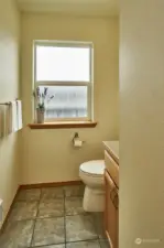 Bathroom on 3rd floor with living room and kitchen.