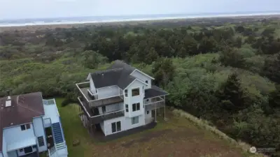 Drone shot -view of home and ocean.