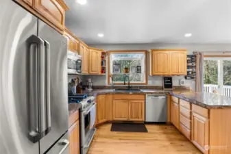 Bright, open kitchen with stainless appliances adjacent to family room!