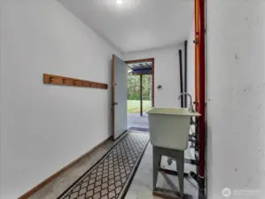 Rear entry offers possibilities of a second laundry/kitchenette space.