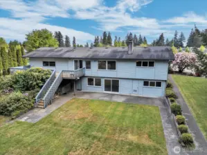 Second angle of rear of home via drone photo.