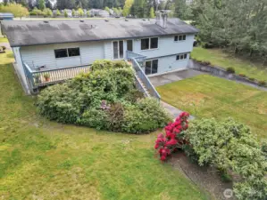 Third view of rear of home via drone.