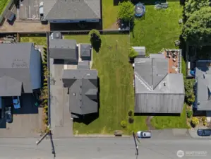 Garden shed behind garage does not convey.