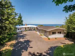 Hidden amongst the trees, this incredible house has unrivaled views!