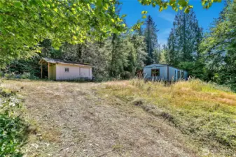 There are 2 sheds also on the property, this one at the top of the driveway is in decent condition, with power running to it.