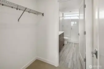 Walk in closet and en-suite bathroom located off of primary bedroom.