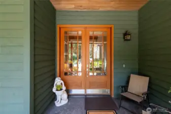 Inviting entry to home with amazing French doors and aggregate patio.