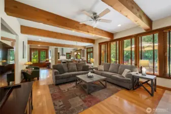 Looking back to over spacious main living space.  Hall on left leads to office, a main floor bedroom and full bath.
