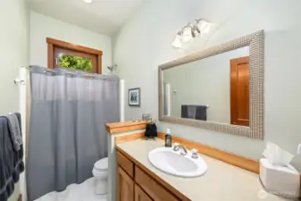 Main floor full bath set between office and bedroom.