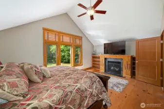 Upper level primary bedroom is spacious with vaulted ceilings and wonderful built ins.