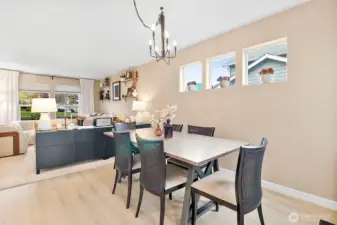 New high-end plank wood flooring extends through the main living areas.