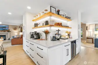 Seamless transition from the butler's buffet into the kitchen creates a built-in coffee bar --perfect for entertaining!