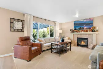 Gas fireplace in the family room, just steps from the kitchen, enhances comfort & style.