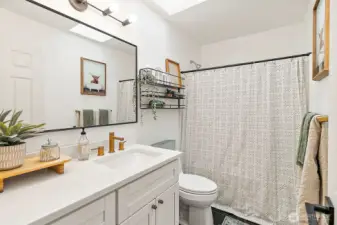 Full bathroom upstairs that has been completely remodeled with modern finishes.