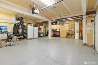 The three car garage offers epoxy flooring & abundant storage, perfect for cars, hobbies or tools!
