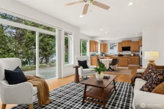 Open Concept flows from kitchen, across breakfast nook, to cozy fireside room...and out to full size patio/BBQ area