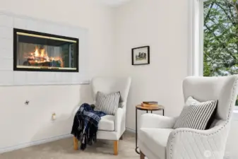 Luxurious Primary bedroom and Bath suite have a dual-facing gas fireplace