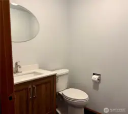Updated bathroom by kitchen