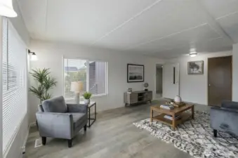 Virtually staged spacious living area.