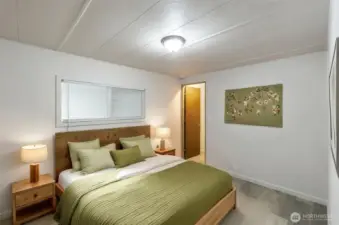 Bedroom 1 with walk in closet. Virtually staged