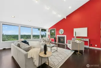 The vaulted ceilings and ample lighting provide an airy, bright space for entertaining, while the fireplace creates an anchor in the room making it feel warm, welcoming and relaxing.